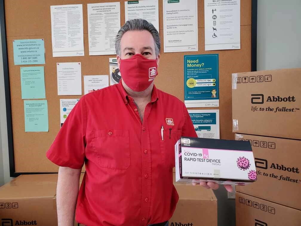 Bill Ecklund, President of the Orillia District Chamber of Commerce, shows one of the new rapid screening tests it is making available to small- and medium-sized businesses in Orillia and area.